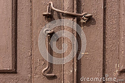 Old window sashes with hooks funny funny on the logic background Stock Photo