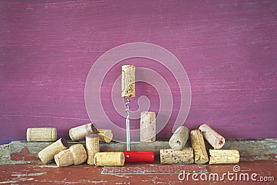 Old wine corks in a row, grungy background Stock Photo