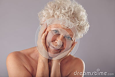 https://thumbs.dreamstime.com/x/old-woman-beautiful-face-close-up-studio-portrait-attractive-senior-her-head-resting-her-hands-against-grey-background-43163599.jpg