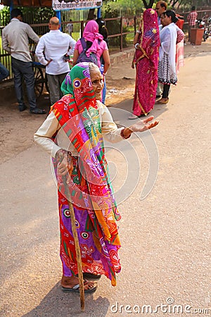 Old woman begging in the street of Fatehpur Sikri, Uttar Pradesh, India Editorial Stock Photo