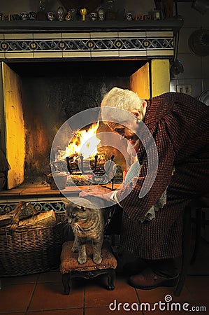 Old woman caressing her cat Stock Photo