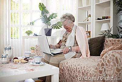 Old woman connecting with her family Stock Photo