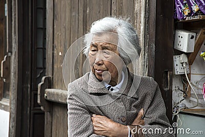 Old woman contemplates the past... Editorial Stock Photo