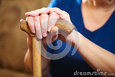 Old woman hands with cane Stock Photo