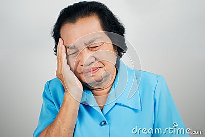 Old woman have a headache Stock Photo