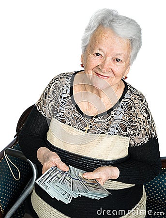 Old woman holding money in hands Stock Photo