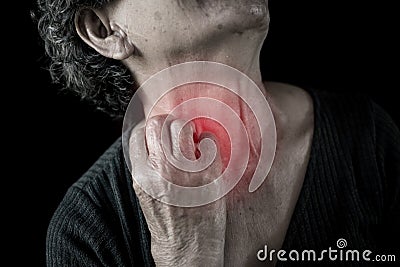 Old woman itching and painful in neck on black background Stock Photo