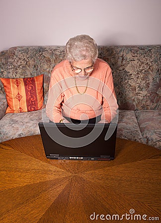 An old woman with a laptop Stock Photo