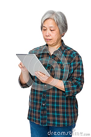 Old woman learn to use tablet Stock Photo