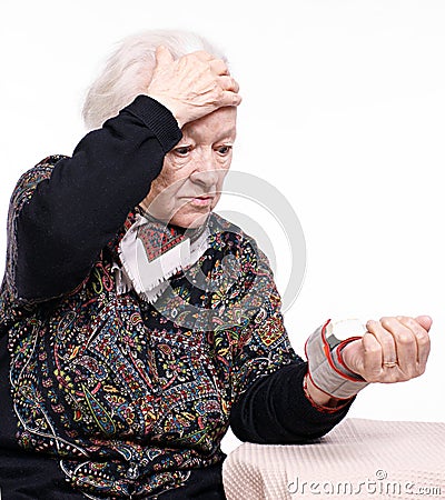 The old woman measures arterial pressure Stock Photo