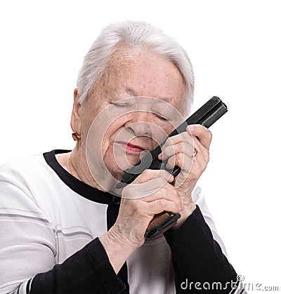 Old woman with pistol Stock Photo