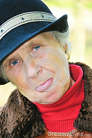 Old woman show tongue Stock Photo