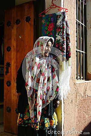 A old woman standing in front of her shop at Abyaneh village, Isfahan, Iran Editorial Stock Photo