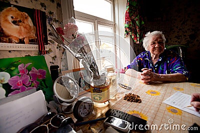 Old woman Veps - small Finno-Ugric people living on territory of Leningrad region in Russia. Editorial Stock Photo