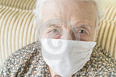 Old woman wearing medical mask for protection of covid19 virus Stock Photo