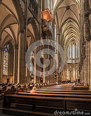 Old women praying in Cologne cathedral in Bonn, Germany Editorial Stock Photo