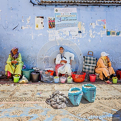 old women sell objects in street Editorial Stock Photo