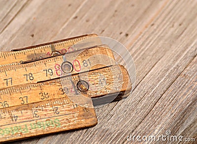 Old wood folding rule on the table Stock Photo