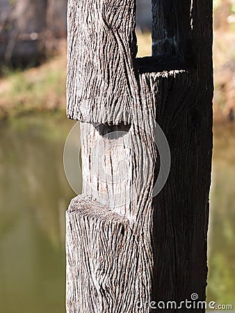 Old wood log pillar standing Stock Photo