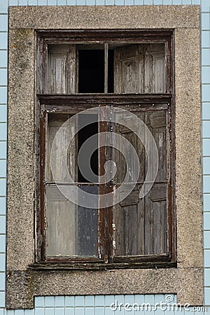 Old wood window half open. Blue portuguese tiles Stock Photo