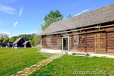 Old wooden barn and traditional village houses, Slovakia Stock Photo