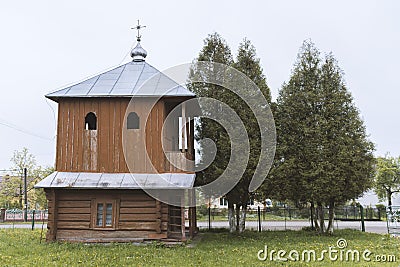 The old wooden bell tower near the church, Western Ukraine Stock Photo