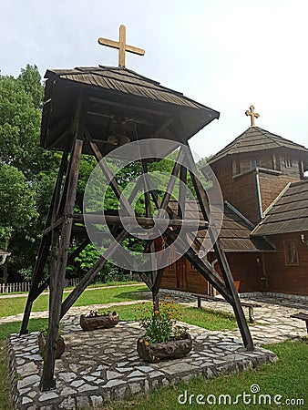 the old wooden bell tower of the village Orthodox Church Stock Photo
