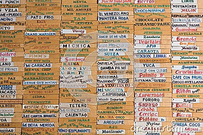 Old wooden board with all ice-cream names written in Spanish, Me Editorial Stock Photo