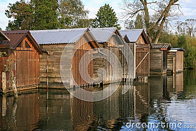 Old wooden boat garages on river Stock Photo