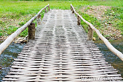 Old wooden bridge over the river Stock Photo