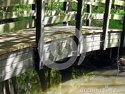 Old wooden bridge over river Stock Photo