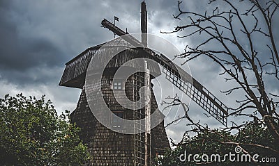 Old wooden broken windmill Stock Photo