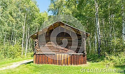 Old wooden building in the forest. Russian barn. ancient, wooden architecture Stock Photo