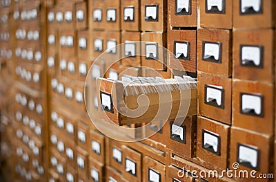 Old wooden card catalogue with one opened drawer Stock Photo