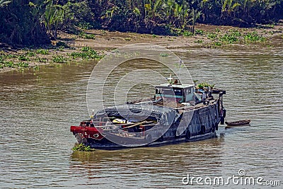 An old wooden cargo vessel anchored in the Soai Rap river Stock Photo