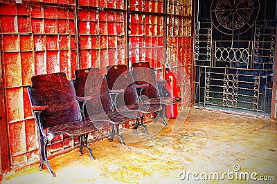 Old wooden chair In the old ired ron wall interior Vintage Stock Photo