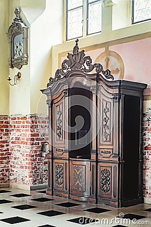 Old wooden confessional Stock Photo