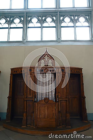 Old, wooden, confessional room keeping secret of a confession, christian attributes Editorial Stock Photo