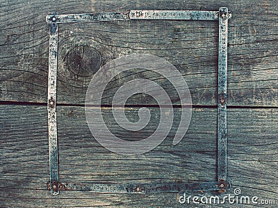 On the old, wooden, cracked, the working surface in the workshop is a vintage, used, rusty, foldable measuring tool - me Stock Photo