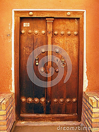 Old wooden door of an Iranian historical house Stock Photo