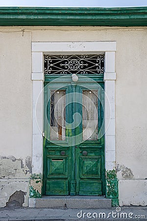 Old wooden door with metal grates Stock Photo