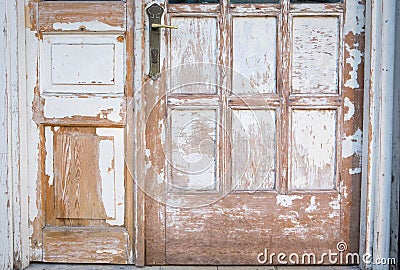 Old Wooden door peeling color texture rusty house background Stock Photo