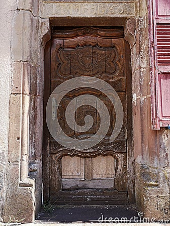 Old wooden door with sandstones Stock Photo