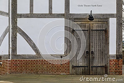 Old wooden door and style timber-framed exterior of the Shakespeare's Globe Theatre in Bankside, London, England Editorial Stock Photo