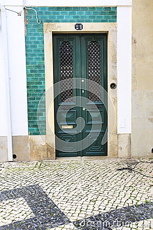Old wooden door with wrought iron details Editorial Stock Photo