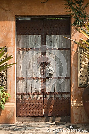 Old wooden doors that are closing outside the house are rusting metal. Constitute Chinese style Stock Photo