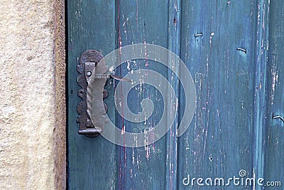 Old wooden entrance door with antique door handle Stock Photo