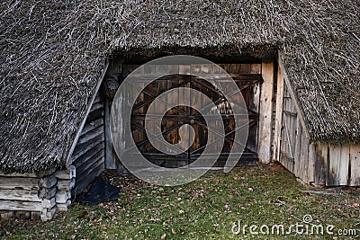 Old wooden entry door to old rustic house in Zervynos, Lithuania Stock Photo