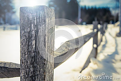 Old Wooden Fence in the Snow Stock Photo
