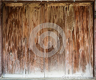 Old wooden folding doors is closed. Stock Photo